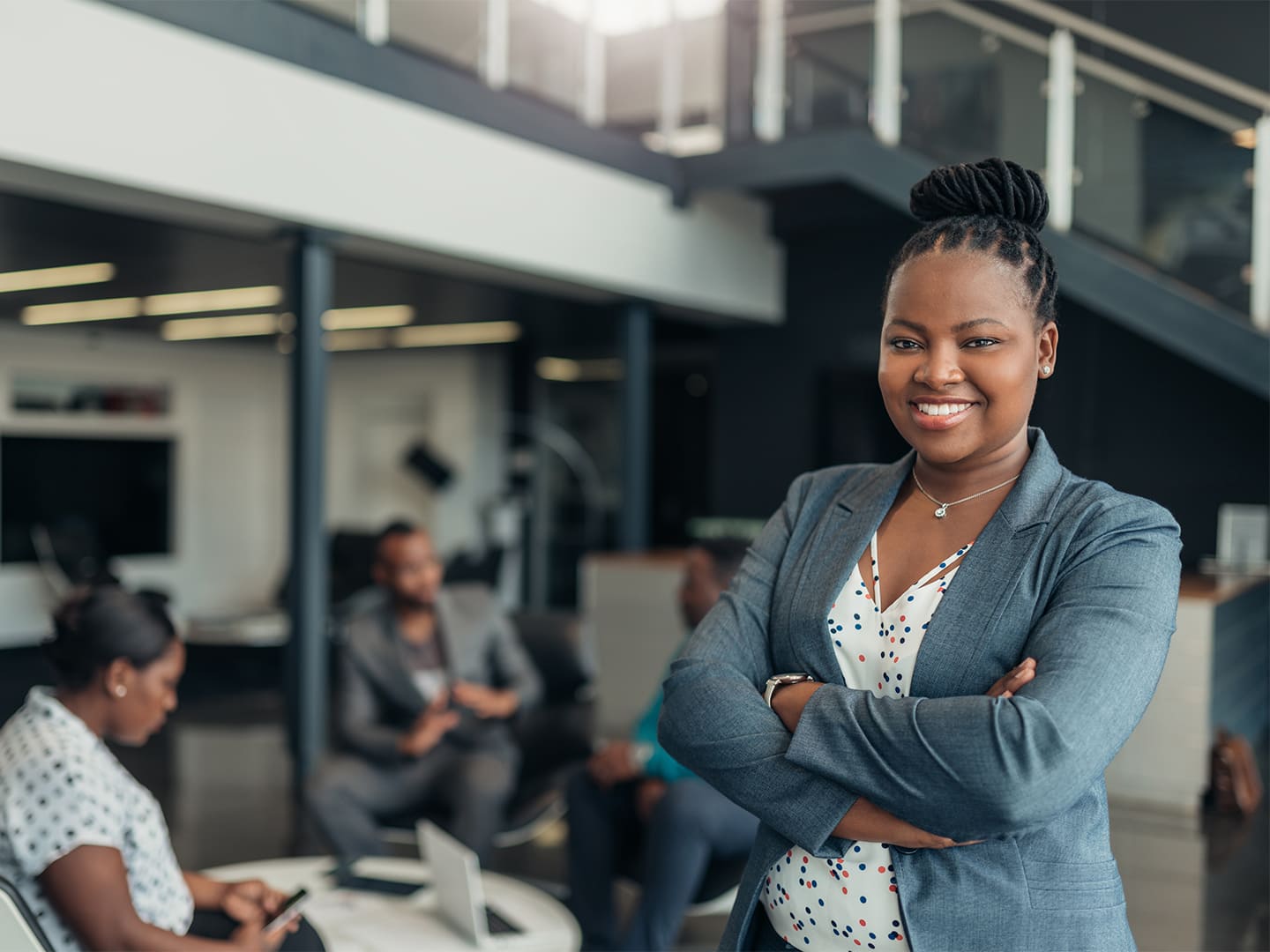 Portrait of a woman in a suit in a meeting room